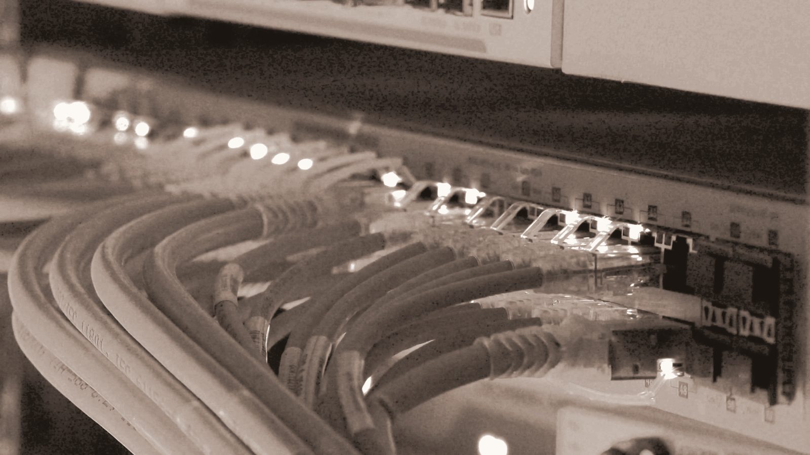 An active network switch, cables and status lights, in motion