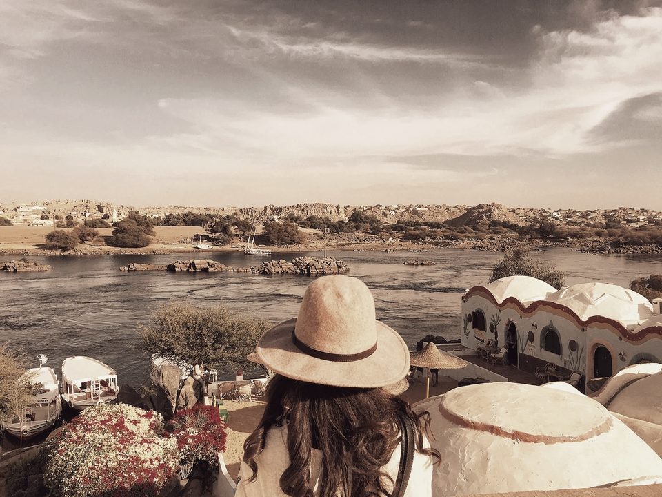 A traveler on a terrace at golden hour